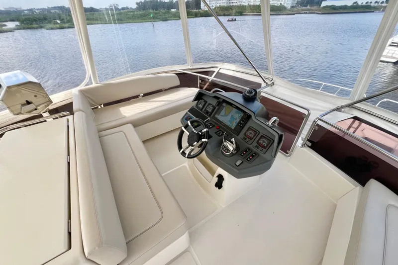 Tonga Time Yacht Photos Pics Luxurious 2019 Aquila 44 yacht helm with modern navigation system and comfortable seating.