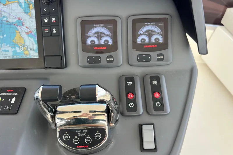 Tonga Time Yacht Photos Pics Control panel of a 2019 Aquila 44 yacht with navigation and engine displays.