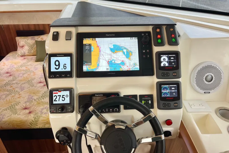 Tonga Time Yacht Photos Pics Helm of 2019 Aquila 44 yacht with navigation screens and controls.