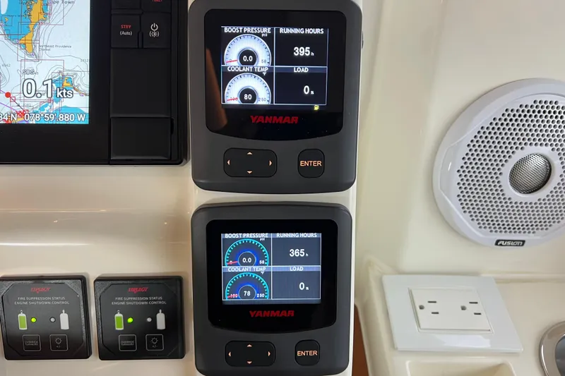 Tonga Time Yacht Photos Pics Control panel of a 2019 Aquila 44 with Yanmar displays and navigation system.