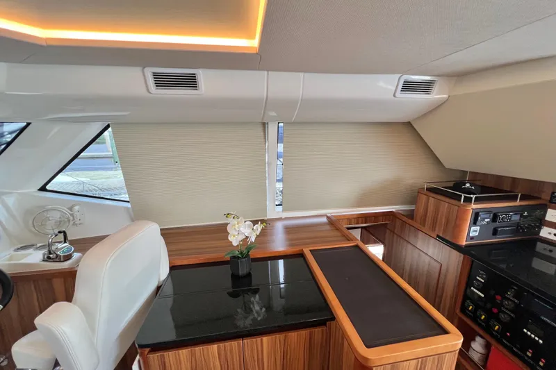 Tonga Time Yacht Photos Pics Luxurious interior of 2019 Aquila 44 yacht with elegant wood finish and modern amenities.