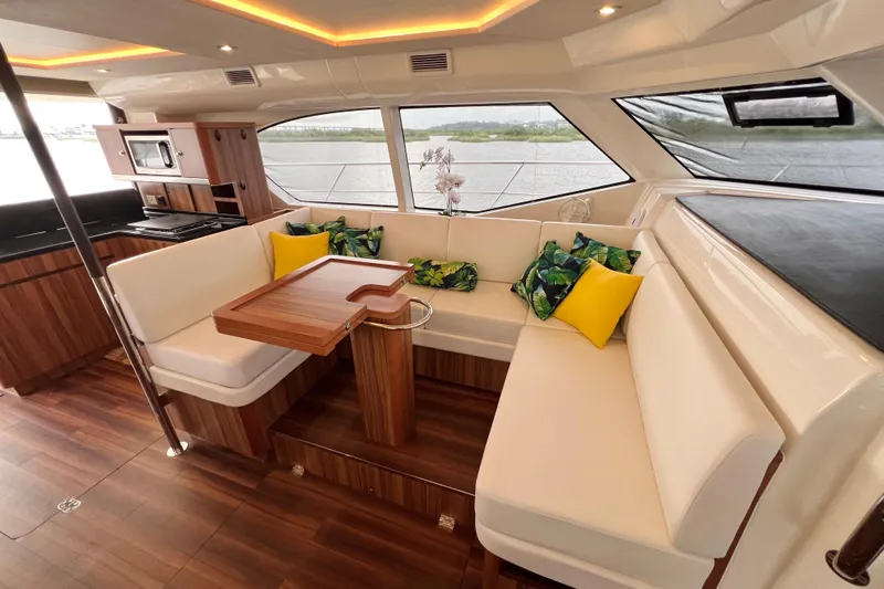 Tonga Time Yacht Photos Pics Luxurious 2019 Aquila 44 yacht interior with elegant seating and modern kitchen amenities.