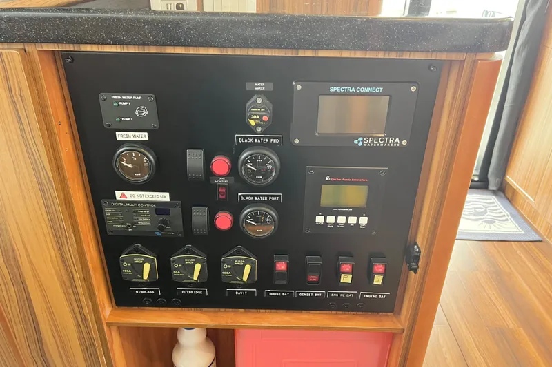 Tonga Time Yacht Photos Pics Control panel of a 2019 Aquila 44 yacht with Spectra watermaker system.