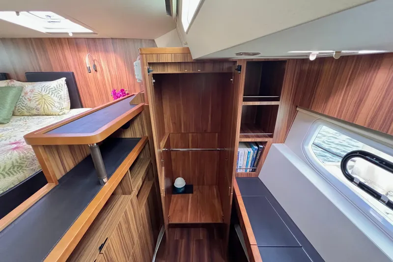 Tonga Time Yacht Photos Pics Luxurious interior of 2019 Aquila 44 yacht with wood finish and cozy bedroom.