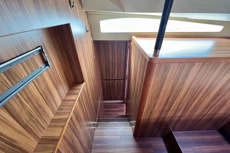 Tonga Time Yacht Photos Pics Interior of 2019 Aquila 44 yacht with sleek wood paneling and modern design.