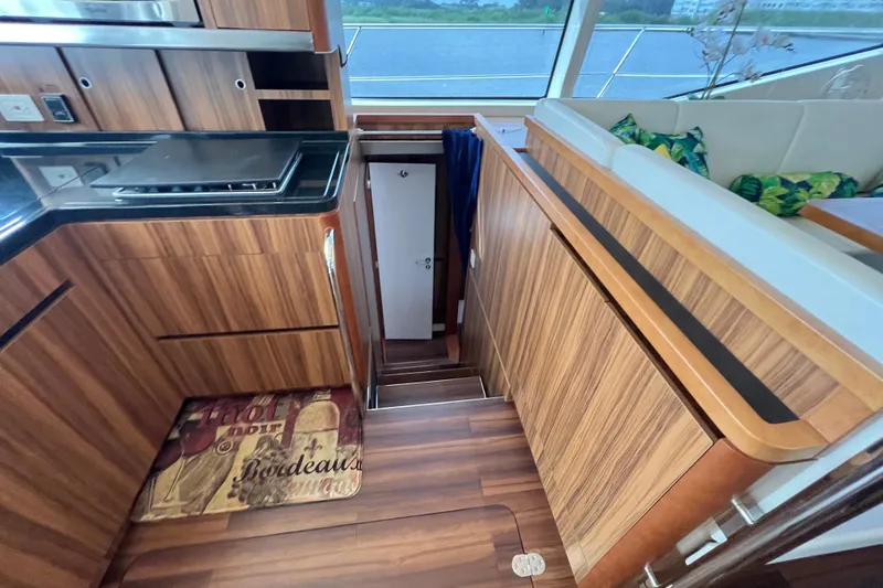 Tonga Time Yacht Photos Pics Luxurious interior of 2019 Aquila 44 yacht with wooden finishes and modern design.