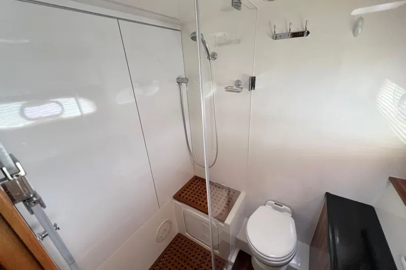 Tonga Time Yacht Photos Pics Modern bathroom in 2019 Aquila 44 yacht with shower and toilet.