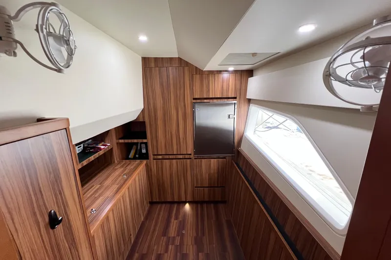 Tonga Time Yacht Photos Pics Luxurious interior of 2019 Aquila 44 yacht with wood paneling and modern design.