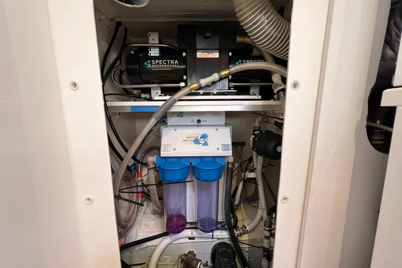 Tonga Time Yacht Photos Pics Water filtration system in a 2019 Aquila 44 yacht, featuring Spectra Watermakers.