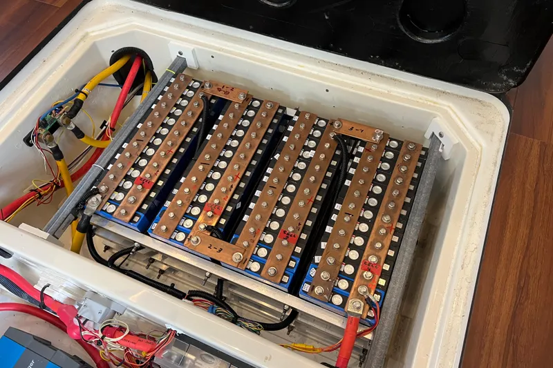 Tonga Time Yacht Photos Pics Battery compartment of a 2019 Aquila 44 with wiring and connections visible.