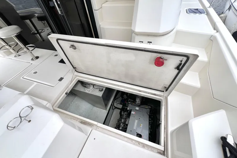 Tonga Time Yacht Photos Pics Engine compartment of 2019 Aquila 44 yacht, open hatch revealing machinery.