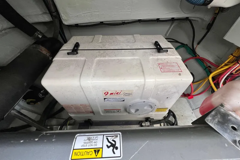 Tonga Time Yacht Photos Pics Engine compartment of 2019 Aquila 44 with generator and wiring.