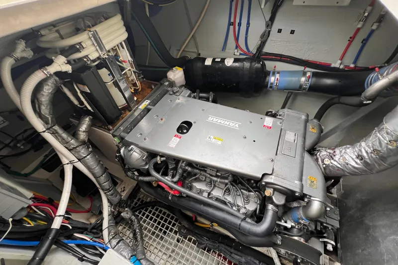 Tonga Time Yacht Photos Pics Engine room of a 2019 Aquila 44 yacht with Yanmar engine and complex wiring.