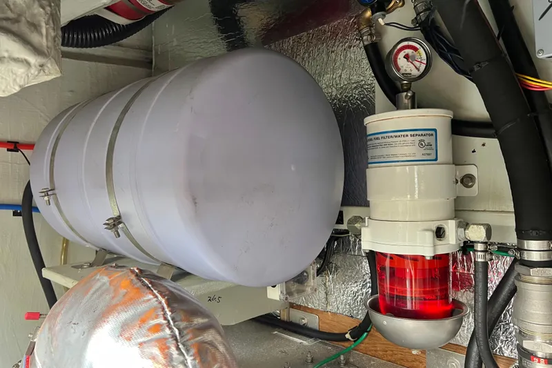 Tonga Time Yacht Photos Pics Engine room of 2019 Aquila 44 with fuel filter and water separator system.