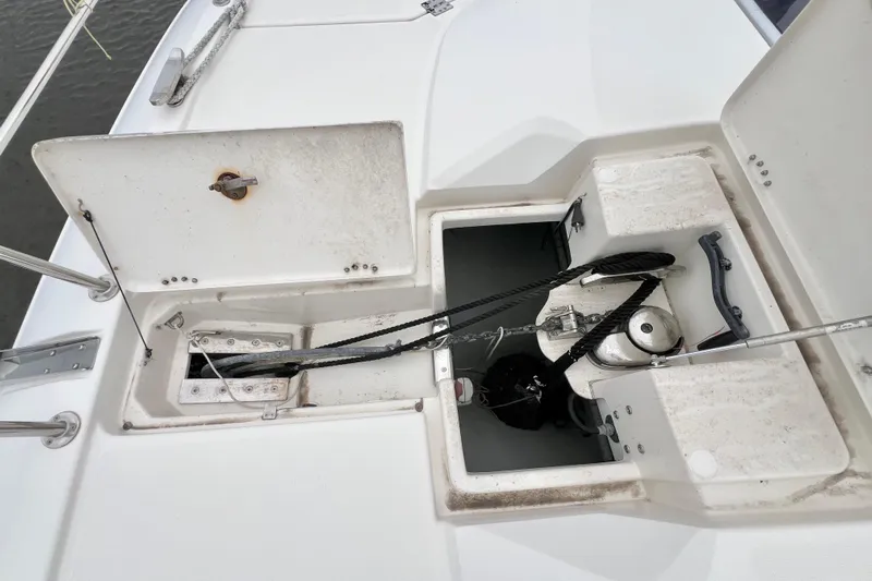 Tonga Time Yacht Photos Pics Open storage compartments on a 2019 Aquila 44 boat deck, showing ropes and equipment.