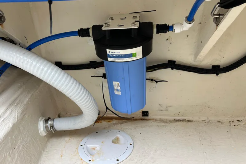 Tonga Time Yacht Photos Pics Water filtration system in 2019 Aquila 44 boat, featuring Pentair Big Blue filter.