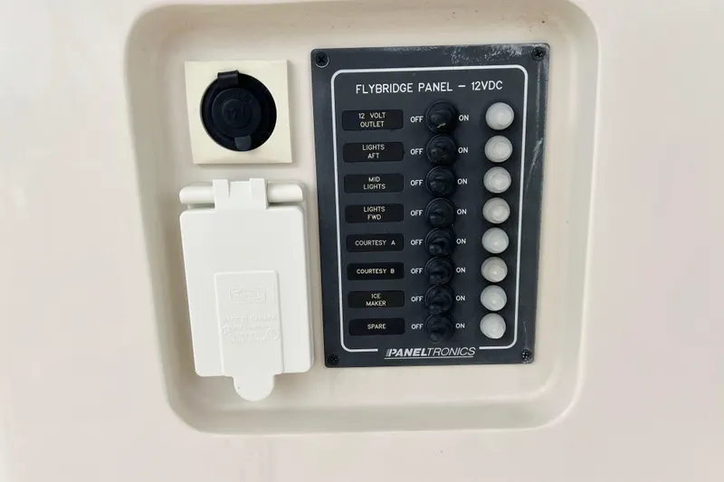 Tonga Time Yacht Photos Pics Flybridge panel on 2019 Aquila 44 yacht with switches and outlets.