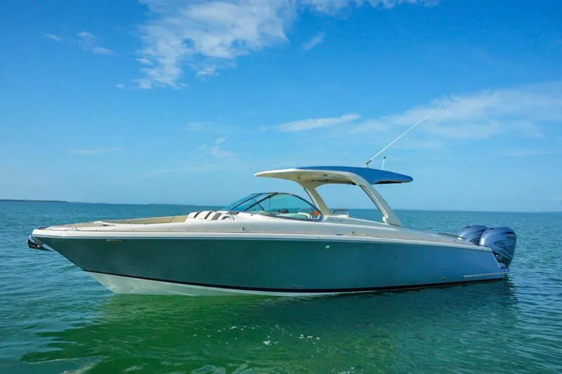  Yacht Photos Pics 2019 Chris-Craft Launch 35 GT OB boat on calm water under blue sky.