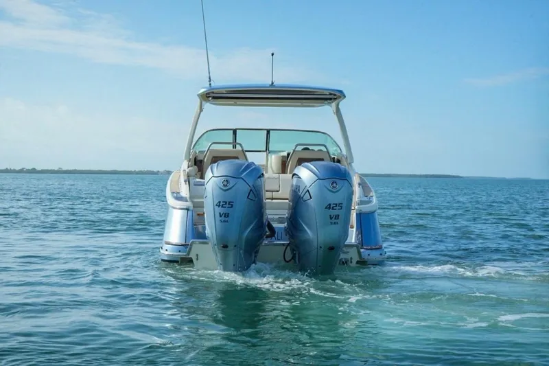  Yacht Photos Pics 2019 Chris-Craft Launch 35 GT OB with dual outboard engines on open water.