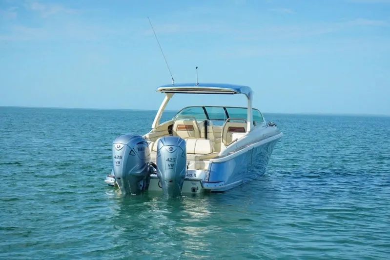  Yacht Photos Pics 2019 Chris-Craft Launch 35 GT OB boat with dual outboard engines on open water.