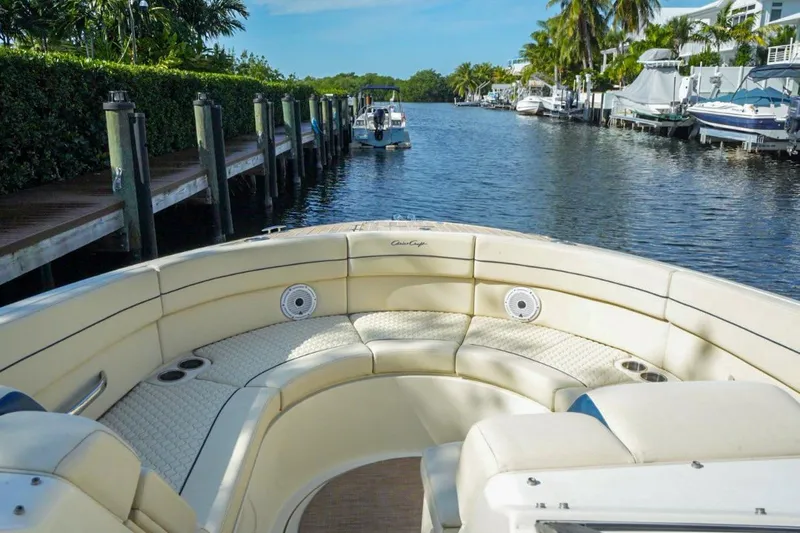  Yacht Photos Pics 2019 Chris-Craft Launch 35 GT OB boat interior with luxurious seating on a sunny waterway.