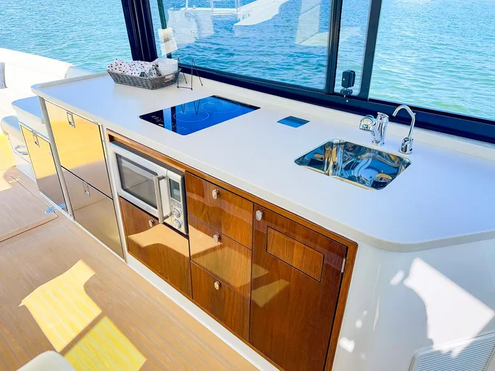 4794tw Yacht Photos Pics Luxurious 2024 MJM 4 yacht kitchen with modern appliances and ocean view.