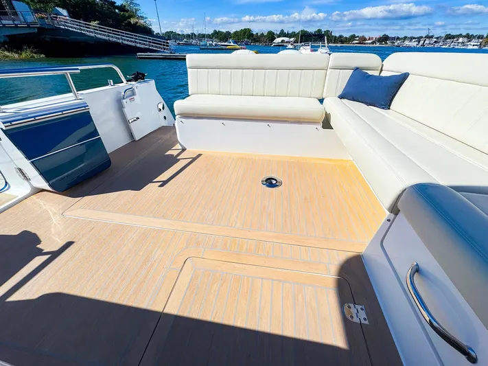 4794tw Yacht Photos Pics Spacious deck of 2024 MJM 4 boat with comfortable seating and scenic waterfront view.