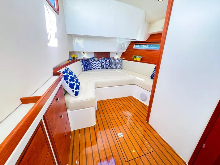 4794tw Yacht Photos Pics Luxurious 2024 MJM 4 yacht interior with elegant seating and wooden flooring.