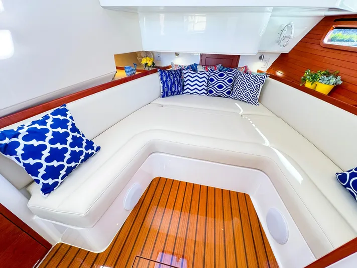 4794tw Yacht Photos Pics Luxurious 2024 MJM 4 yacht interior with elegant seating and decorative pillows.