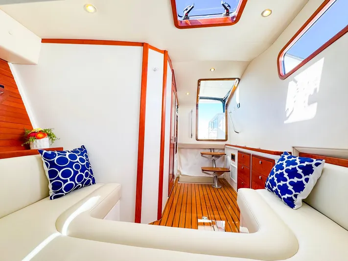 4794tw Yacht Photos Pics Luxurious 2024 MJM 4 yacht interior with elegant seating and nautical decor.