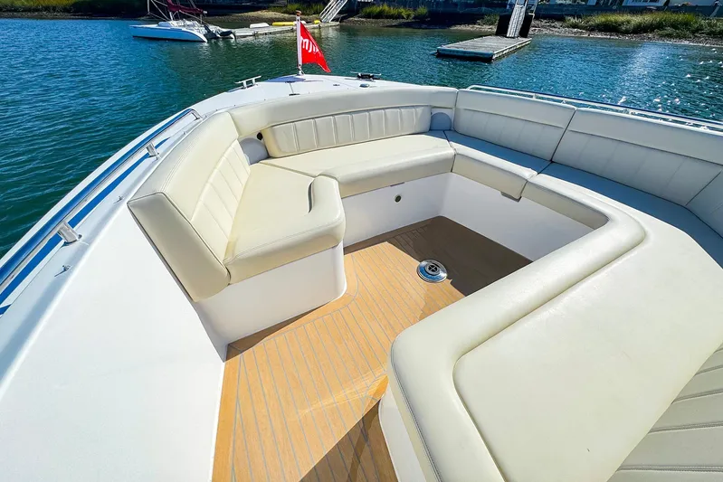 4794tw Yacht Photos Pics Luxurious seating area on 2024 MJM 4 boat with scenic water view.