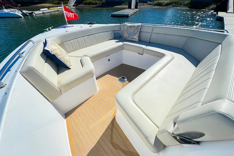 4794tw Yacht Photos Pics Luxurious seating area on 2024 MJM 4 boat, featuring elegant cushions and sleek design.