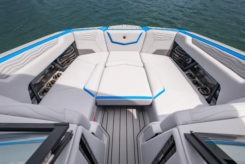 Yacht Photos Pics 2026 Nautique Super Air Nautique G23 boat interior with luxurious seating and cup holders.