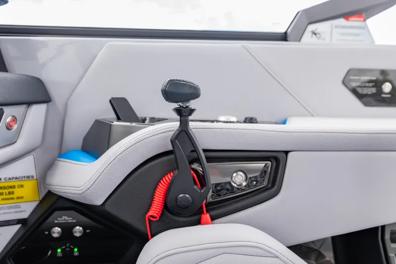  Yacht Photos Pics Interior of 2026 Nautique Super Air Nautique G23 boat, featuring control panel and throttle.