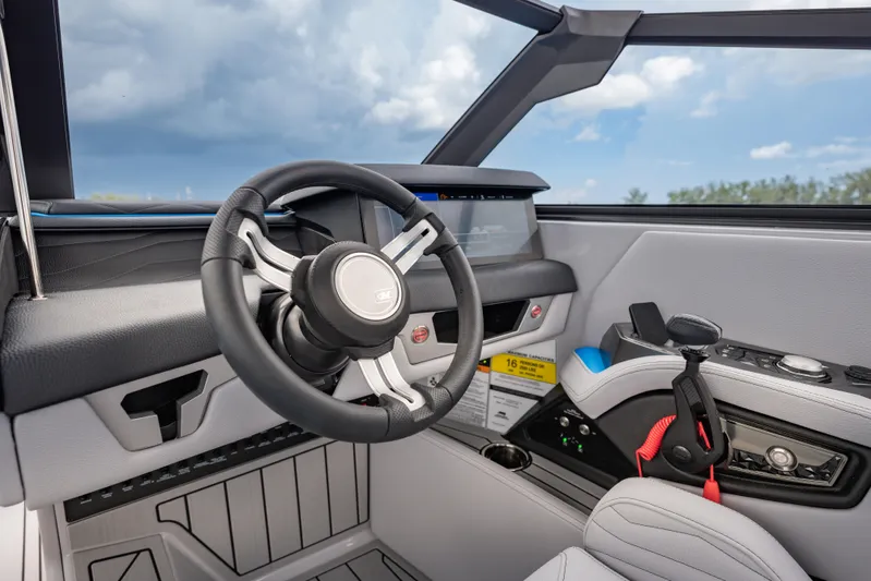  Yacht Photos Pics 2026 Nautique Super Air Nautique G23 helm with modern steering and controls.