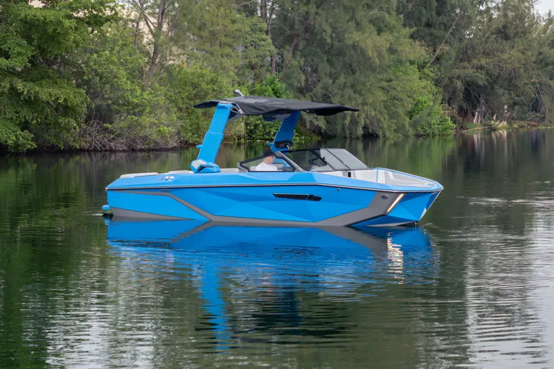  Yacht Photos Pics 2026 Nautique Super Air Nautique G23 boat in serene lake setting.