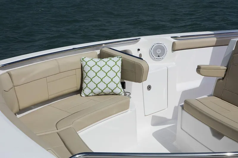 Amuninni Yacht Photos Pics Manufacturer Provided Image: 2021 Pursuit S 328 Sport boat interior with beige seating and decorative pillow.
