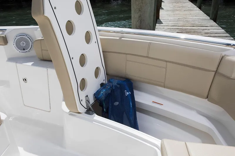 Amuninni Yacht Photos Pics Manufacturer Provided Image: 2021 Pursuit S 328 Sport boat storage compartment with beige seating.