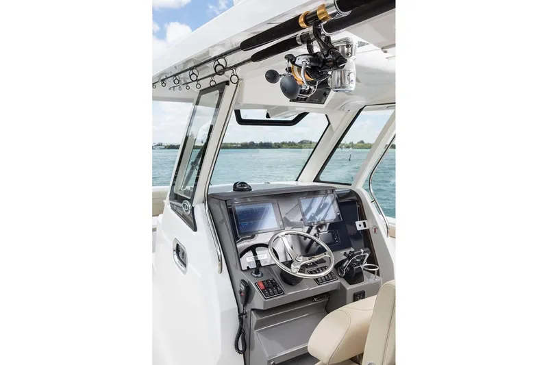 Amuninni Yacht Photos Pics Manufacturer Provided Image: 2021 Pursuit S 328 Sport boat helm with advanced navigation systems.