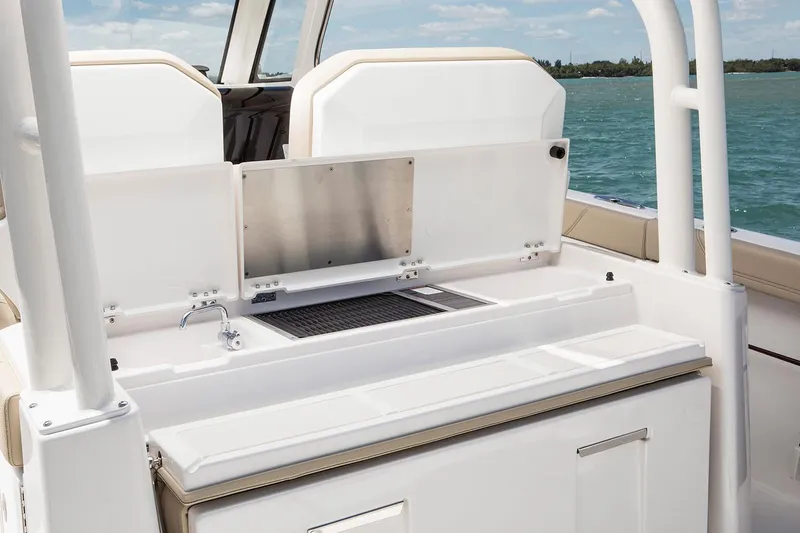 Amuninni Yacht Photos Pics Manufacturer Provided Image: 2021 Pursuit S 328 Sport boat interior with sink and storage.