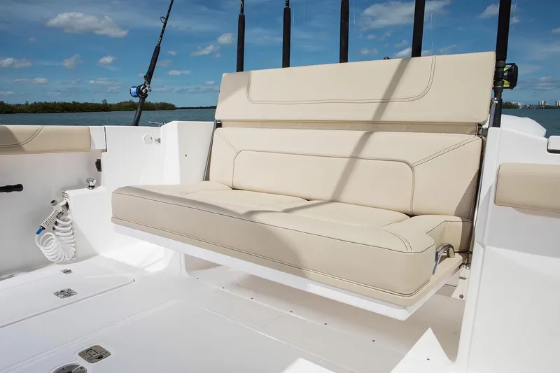 Amuninni Yacht Photos Pics Manufacturer Provided Image: 2021 Pursuit S 328 Sport boat with beige seating and fishing rod holders.