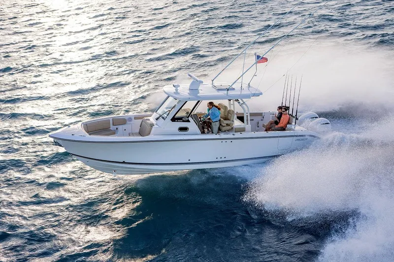 Amuninni Yacht Photos Pics Manufacturer Provided Image: 2021 Pursuit S 328 Sport boat cruising on open water.