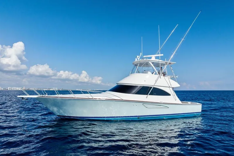 Lollipop Yacht Photos Pics 2022 Viking 48 Convertible yacht on open sea under clear blue sky.