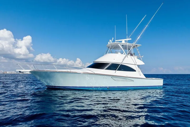 Lollipop Yacht Photos Pics 2022 Viking 48 Convertible yacht on open sea under clear blue sky.