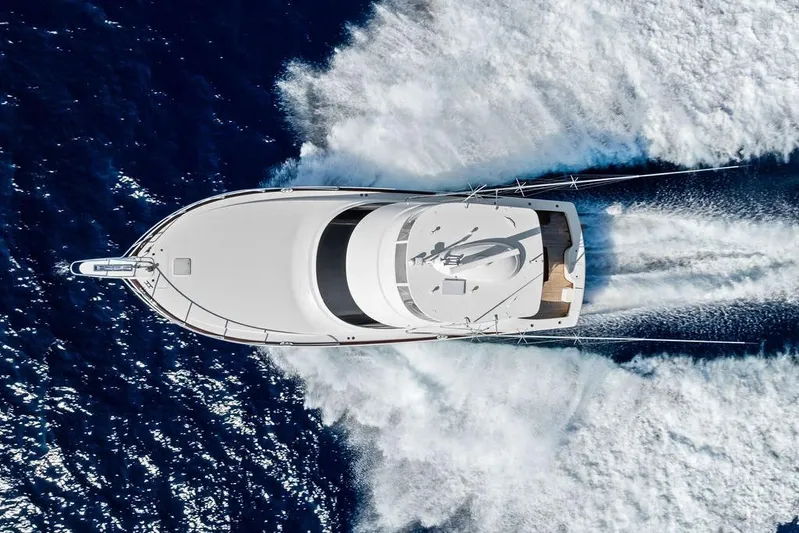 Lollipop Yacht Photos Pics Aerial view of 2022 Viking 48 Convertible yacht cruising on open sea.