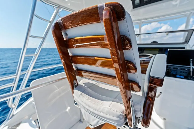Lollipop Yacht Photos Pics Captain's chair on 2022 Viking 48 Convertible yacht, overlooking ocean.