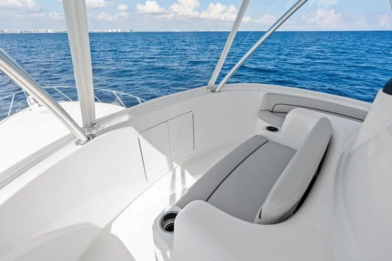 Lollipop Yacht Photos Pics 2022 Viking 48 Convertible yacht interior with ocean view, featuring sleek seating.