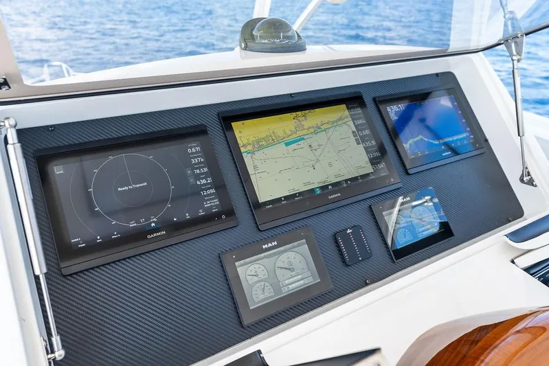 Lollipop Yacht Photos Pics Control panel of 2022 Viking 48 Convertible yacht with navigation displays.