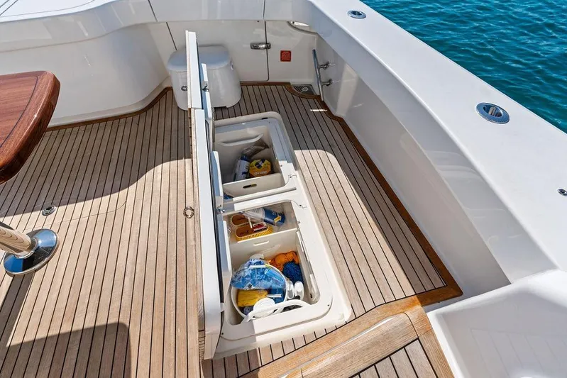 Lollipop Yacht Photos Pics 2022 Viking 48 Convertible yacht deck with open storage compartments.