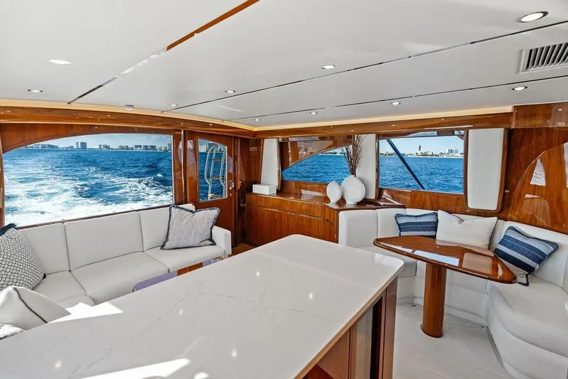 Lollipop Yacht Photos Pics Luxurious interior of 2022 Viking 48 Convertible yacht with ocean view.
